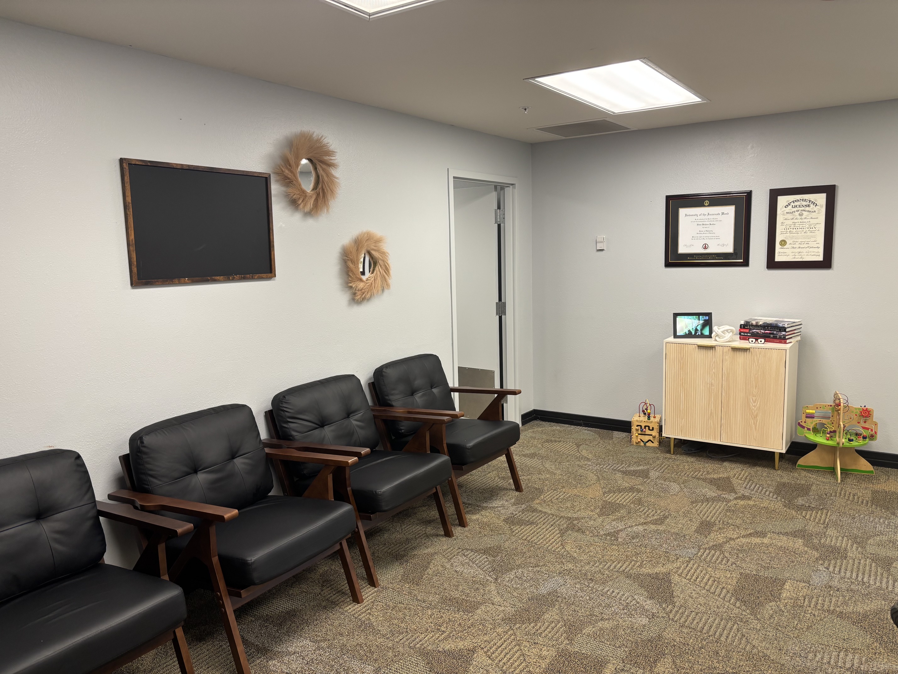 Comfortable waiting area at EB Vision with family-friendly seating