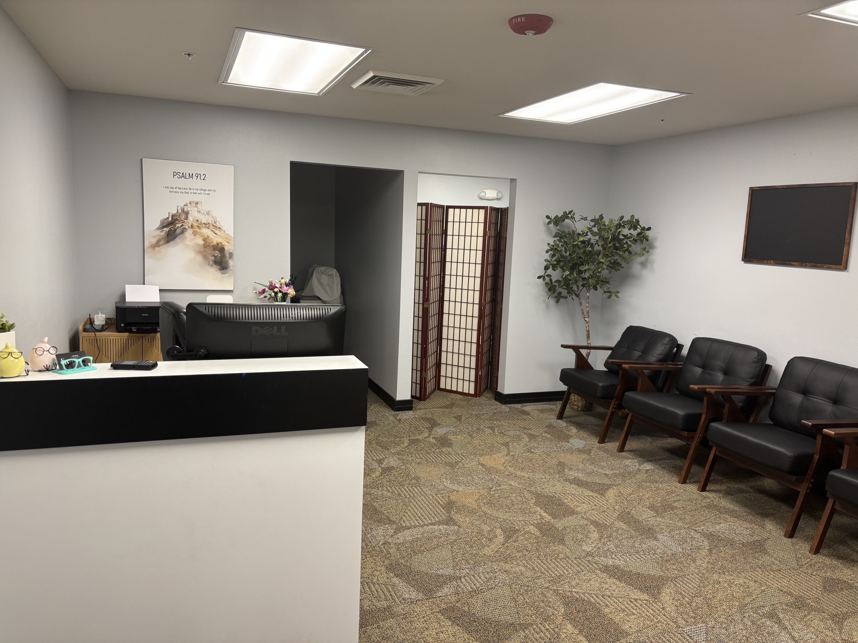 Exam lane with patient chair and slit lamp for comprehensive eye exams